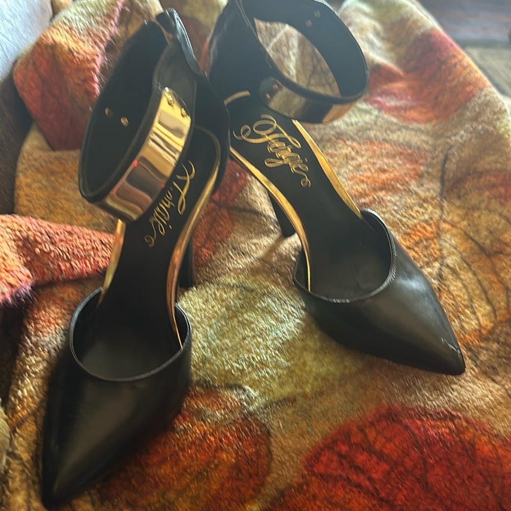 Fergie black high healed shoe with gold accents